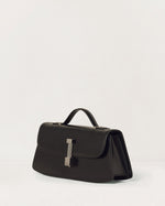 Kassandre Colonne clutch in black cow leather with silver hardware, rigorous lines, three quarter view