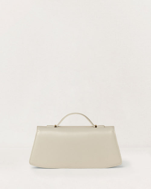 Kassandre Colonne clutch in off-white cow leather with gold hardware, rigorous lines, back view