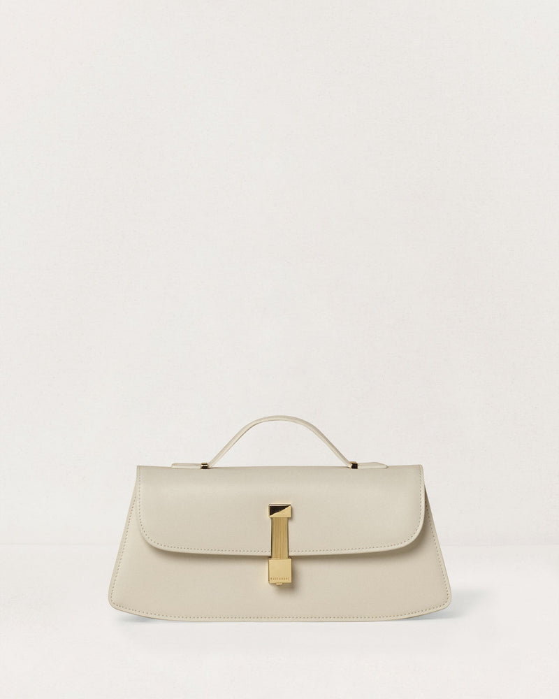 Kassandre Colonne clutch in off-white cow leather with gold hardware, rigorous lines, front view