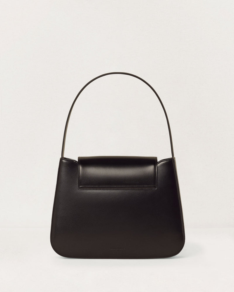 Kassandre Colonne hobo bag in black cow leather with gold hardware, column volume, back view