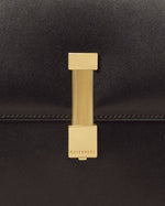 Kassandre Colonne hobo bag in black cow leather with gold hardware, column volume, detail view