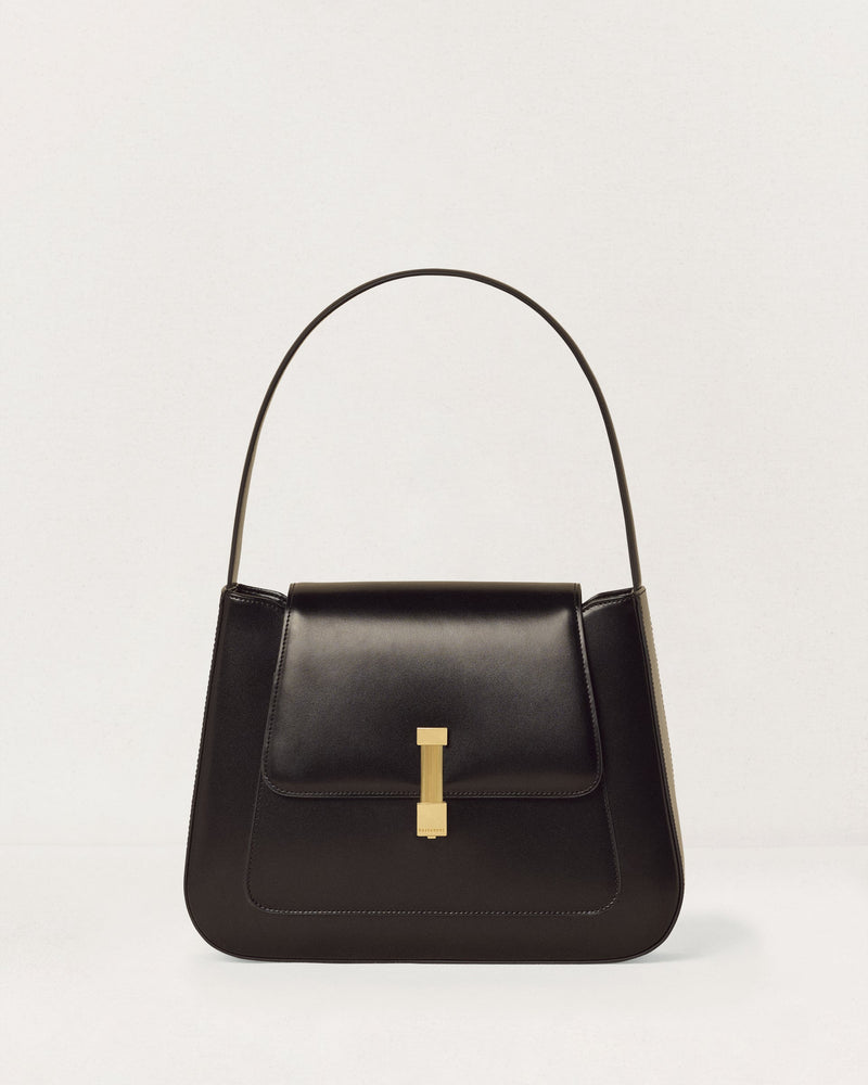 Kassandre Colonne hobo bag in black cow leather with gold hardware, column volume, front view