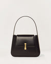 Kassandre Colonne hobo bag in black cow leather with gold hardware, column volume, front view