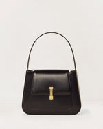 Kassandre Colonne hobo bag in black cow leather with gold hardware, column volume, front view