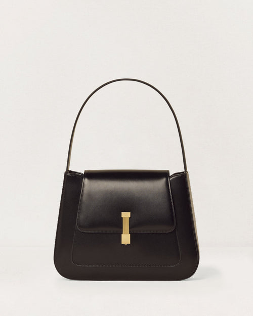 Kassandre Colonne hobo bag in black cow leather with gold hardware, column volume, front view