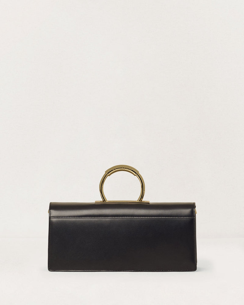 Kassandre Deva clutch in black cow leather with gold hardware, Art Deco geometry,removable strap , crossbody bag , back view