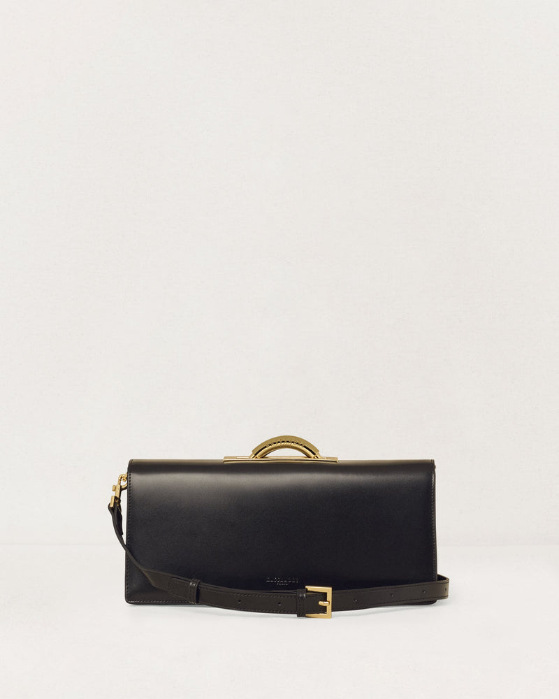 Kassandre Deva clutch in black cow leather with gold hardware, Art Deco geometry,removable strap , crossbody bag , front view