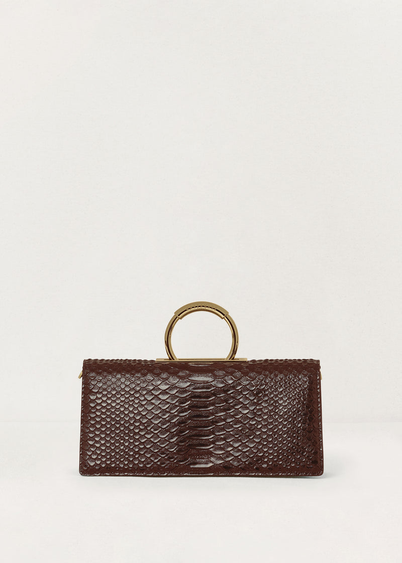 Kassandre Deva clutch in brown python-effect leather, sculptural Art Deco geometry, removable strap , crossbody bag ,front view