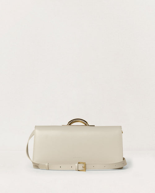 Kassandre Deva clutch in off-white cow leather, pure geometric form, adjustable strap, removable strap , crossbody bag ,back view