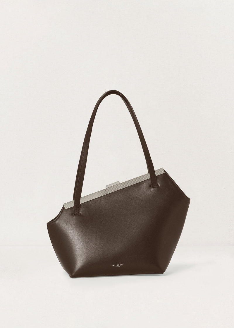 Kassandre Eileen asymmetric shoulder bag in brown cow leather, silver frame, graphic geometry, front view