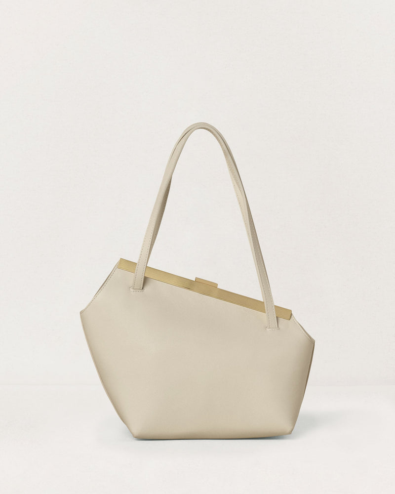 Kassandre Eileen asymmetric shoulder bag in off-white cow leather, clean line, gold frame, back view