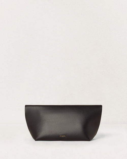 Kassandre Eileen clutch in black cow leather with gold striped metal gold frame and engraved clasp back view