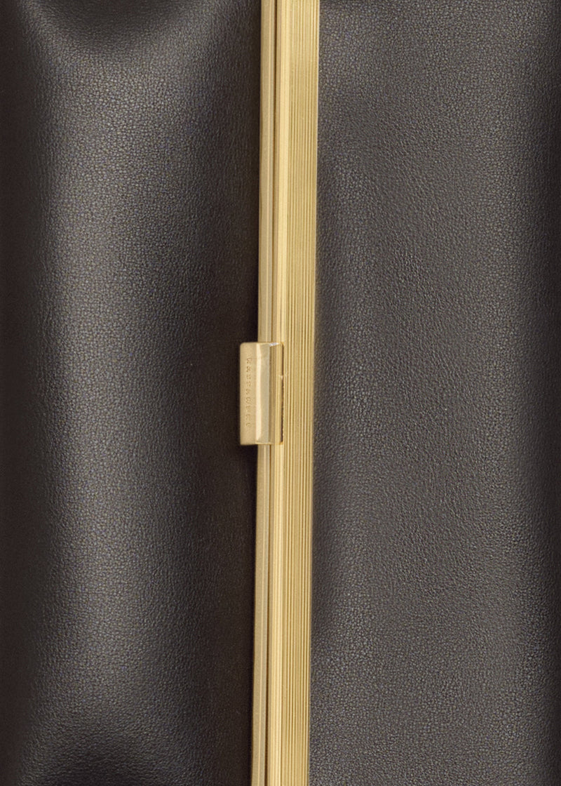 Kassandre Eileen clutch in black cow leather with gold striped metal gold frame and engraved clasp