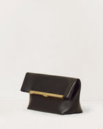 Kassandre Eileen clutch in black cow leather with gold striped metal gold frame and engraved clasp three quarter view