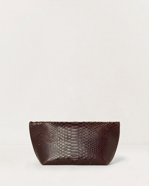 Kassandre Eileen clutch in brown python-effect leather with striped metal frame, back view