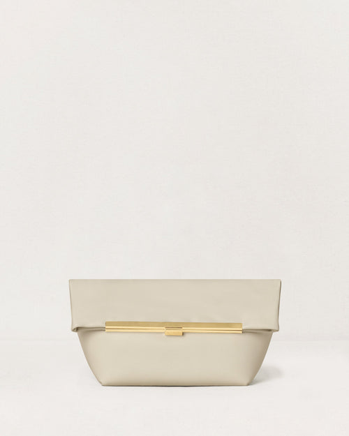 Kassandre Eileen clutch in off-white cow leather with gold metal frame, Art Deco lines, front view