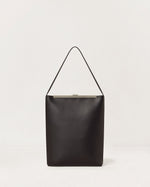 Kassandre Eileen computer bag in black cow leather with silver striped metal frame, back view
