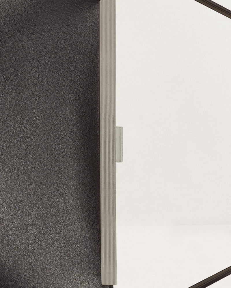 Kassandre Eileen computer bag in black cow leather with silver striped metal frame detail view