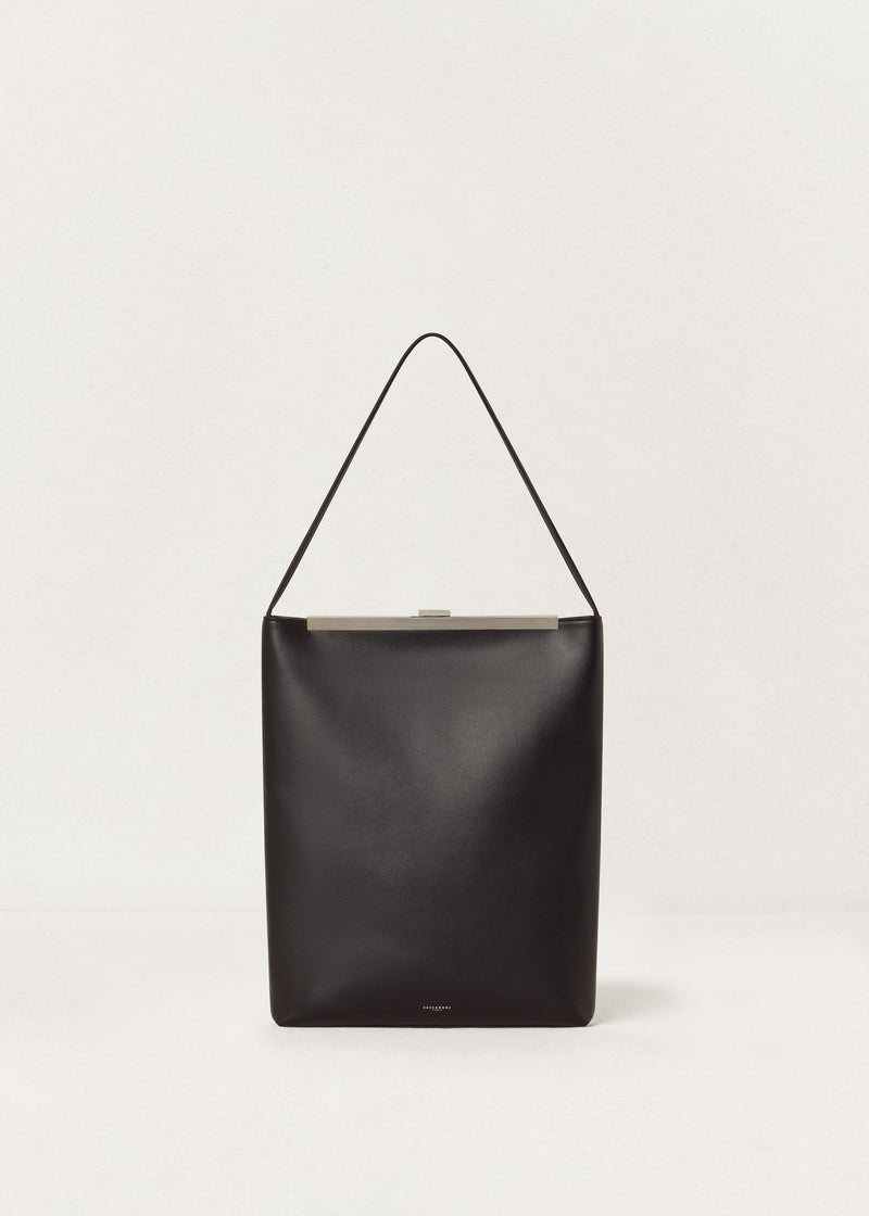 Kassandre Eileen computer bag in black cow leather with silver striped metal frame, front view