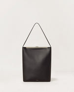 Kassandre Eileen computer bag in black cow leather with silver striped metal frame, front view