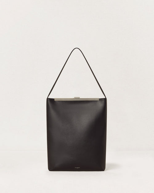 Kassandre Eileen computer bag in black cow leather with silver striped metal frame, front view
