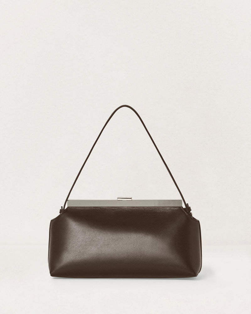 Kassandre Eileen shoulder bag in brown smooth cow leather with striped metal frame, back view