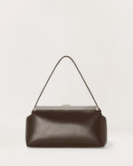 Kassandre Eileen shoulder bag in brown smooth cow leather with striped metal frame, back view